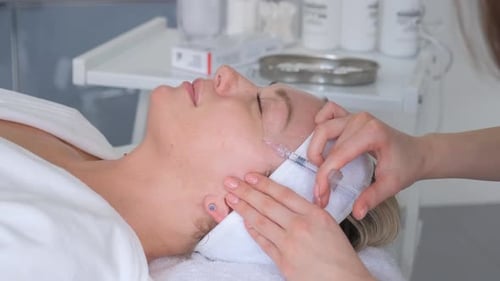 Botox Injection on a Woman's Face Rejuvenating Injections Fight Against Aging of the Skin of Face