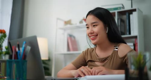 Woman Engaged in a Lively Video Call at Home