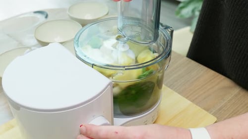 Food Processor Mixes Garlic, Greens, and Potatoes