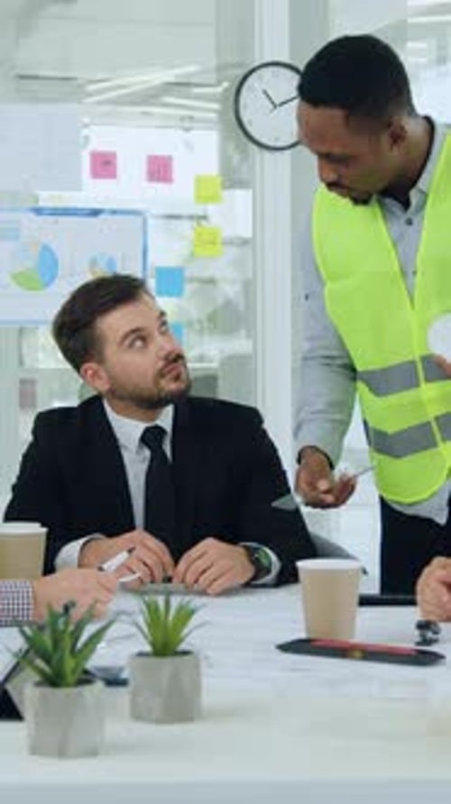 Attractive Professional African American Specialist in Building Industry Discussing with His Male