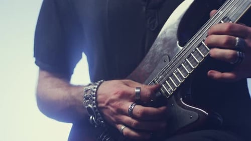 Expressive rock guitarist plays electric guitar music with passion and expression