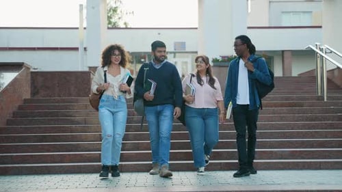 Diverse Group of University Students Walking Downstairs