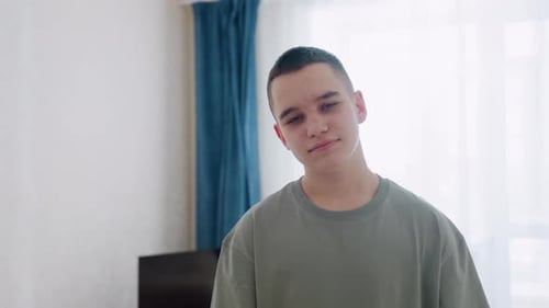 Teen smiling in naturally lit indoor room
