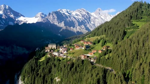 Descending drone shot of Murren, a traditional Walser mountain village in the Bernese Highlands of S