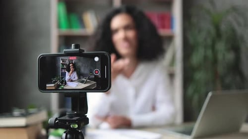 Woman Recording Video Blog on Smartphone at Home