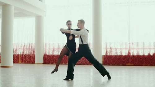 Beautiful Couple of Professional Artists Dancing Passionate Dance