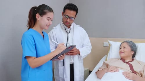 Specialist doctor man and nurse explaining and check with elderly patient in hospital.