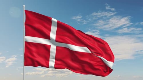 Denmark Flag Moving Freely in the Air Against a Bright Sky