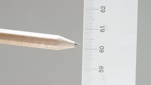 We measure the distance opposite to the pencil with a ruler, the concept of building a house.