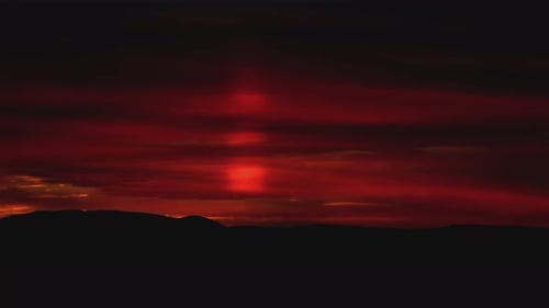 Dramatic Sunset over a Mountain Range Silhouette