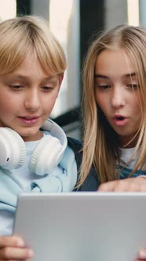 Two School Children Pupils Girl and Boy Classmates Friends Sitting on Stairs Street Outdoors Near