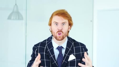 Angry Man Yelling with Red Hair Indoors