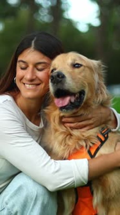 Happy Young Woman Hugging Golden Retriever Dog
