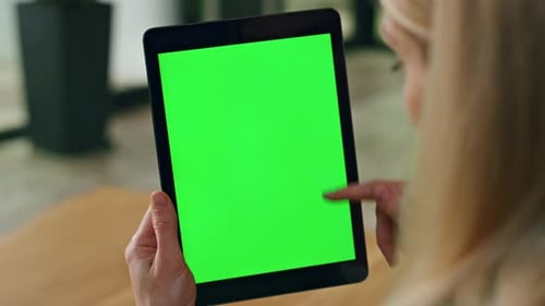 Lady Finger Swiping Greenscreen Tablet at Office