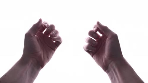 Close Up Of Man's Hands Clench Into Fists, Isolated In White Background - studio shot