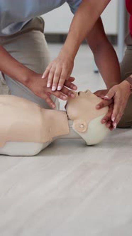 Hands, first aid or breathing with mannequin for CPR training, health or safety workshop