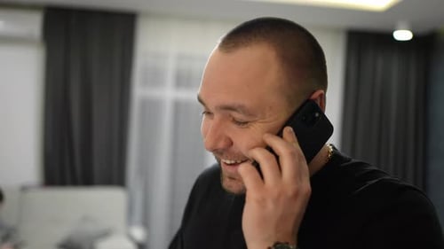 Man Talking on Phone Indoors