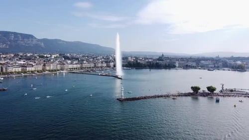 Aerial View Of Jet d'Eau, Stunning Fountain In Lake Geneva In Geneva, Switzerland. pullback