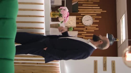 Hotel Receptionist Helping Guest at Lobby Front Desk