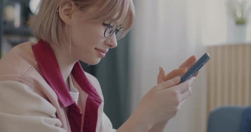 Woman Using Mobile Phone Indoors Daytime
