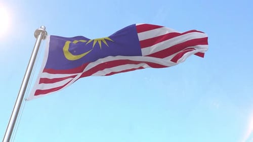 Realistic Waving Flag of Malaysia Against Blue Sky