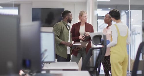 Diverse group of male and female business colleagues working in office