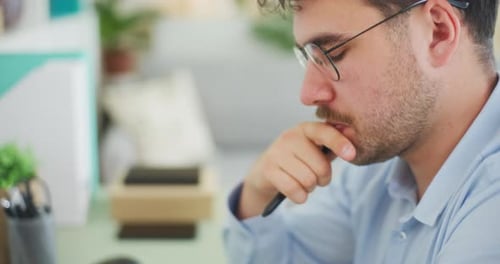 Confident Man Thinking in Office