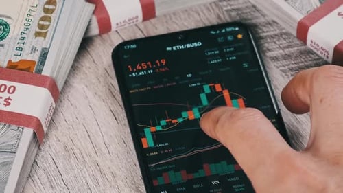 Investor Checking Cryptocurrency Ethereum Price on Smartphone Screen ETH