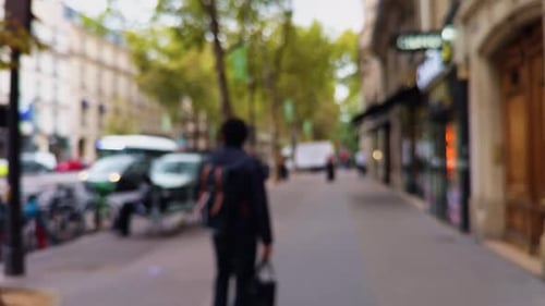 A Vibrant Urban Street Scene Featuring Pedestrians Shops and a Lively City Environment in Daylight