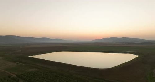 Aerial View of Lake at Sunrise or Sunset