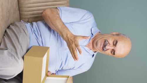 Vertical video of The old man who got angry with the cargo content. Wrong shipping.