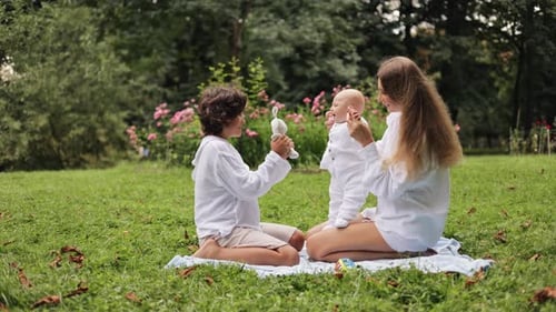 Happy Family Having Fun in the Park