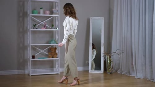 Woman Posing in Fashionable Outfit in Room