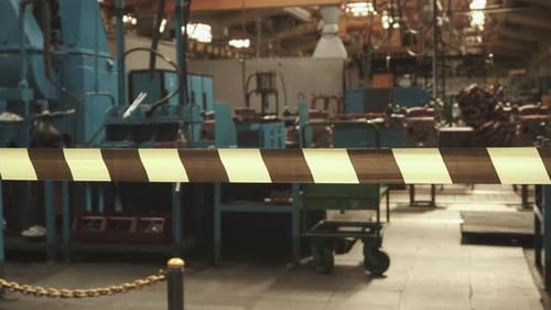 Restrictive Black and Yellow Tape in Industrial Building of Closed Plant