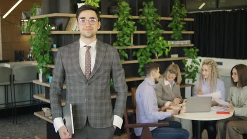 Smiling Business Man in Modern Office Environment