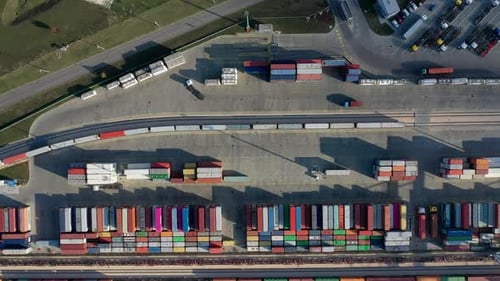 Cargo trains leaving the terminal with containers. Heavy industry.