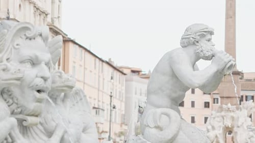 Ancient Marble Statues in a Historical Urban Setting