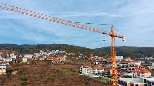 Rising to the boom of the huge yellow construction crane.