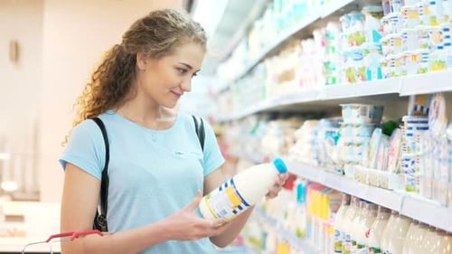 One Female Mistress Alone Look For Milk Freshness Quality Ingredient In Town Marketplace. Smile A...