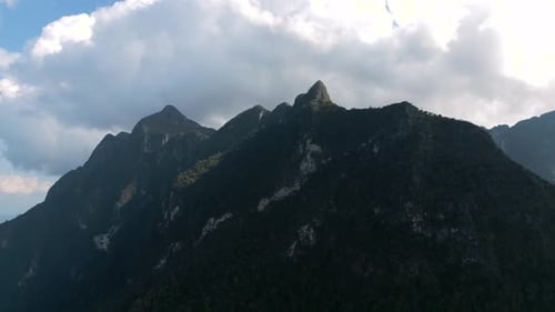 Breathtaking High Altitude Aerial View of Jagged Dark Mountain Peaks