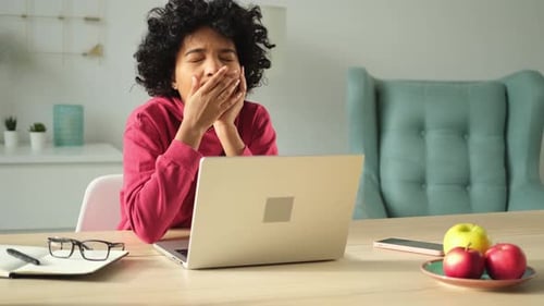 Sleepy African American Woman Sitting at Table with Laptop and Yawning Tired Overworked Girl Lazy to