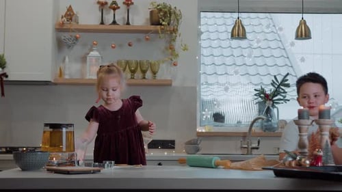 Smiling Children Making Holiday Cookies Together in Kitchen
