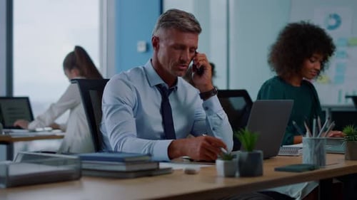 Professionals working together in an open office