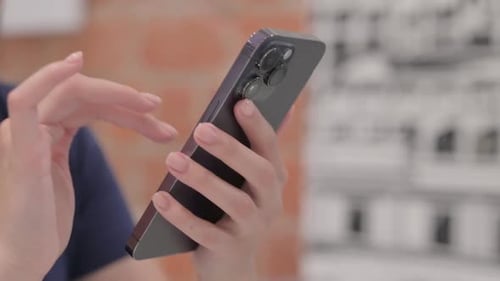 Close up of Female Hand Using Smartphone