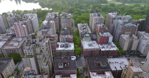 Residential area with diverse houses at daytime. Beautiful green park and river right behind