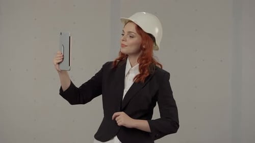 Female Engineer on Video Chat with Tablet