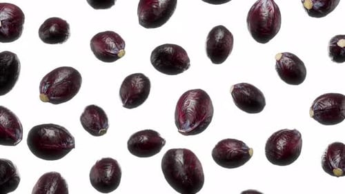 Rotating Red Cabbages Falling on White Background