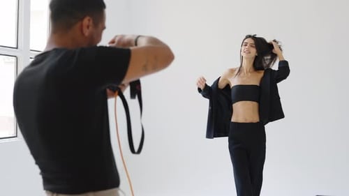 Model Posing for Fashion Shoot in Bright Studio