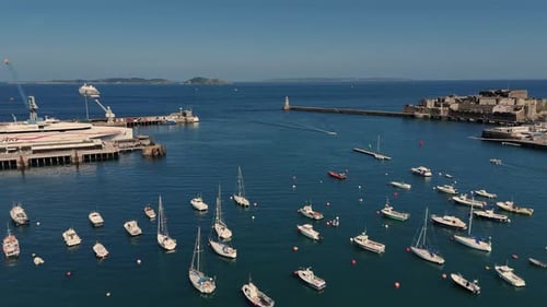 Guernsey St Peter Port Harbour. Panning shot of outer harbour from Castle Cornet, past ferry docked