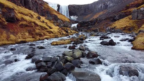 Huge Scenic Waterfall in Iceland Pure Glacier River in Mountains Autumn Colours Aerial View